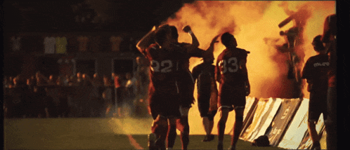 a group of soccer players wearing jerseys with the numbers 21 and 33