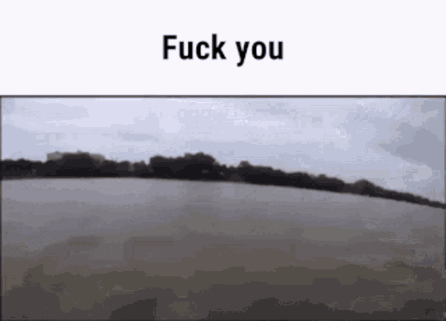 a picture of a field with the words " fuck you " on top