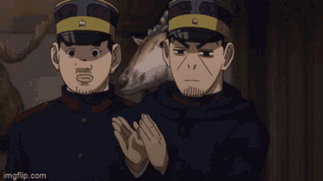 two men in military uniforms are standing next to each other in front of a stuffed animal