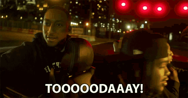 a group of people sitting in a car with the words toooodaaay written on the screen