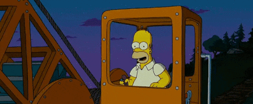 homer simpson from the simpsons is driving a crane