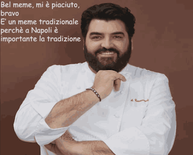 a man with a beard wearing a white chef 's jacket with the words bel meme mi e piaciuto bravo