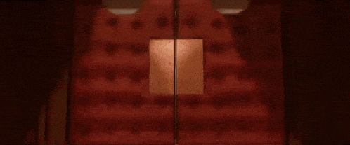 a cartoon character wearing a chef 's hat is standing in front of a refrigerator .