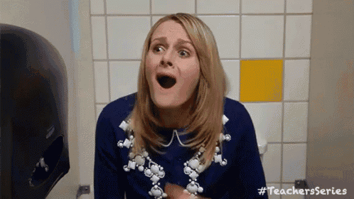 a woman is sitting on a toilet with her mouth open and a handkerchief in her hand .