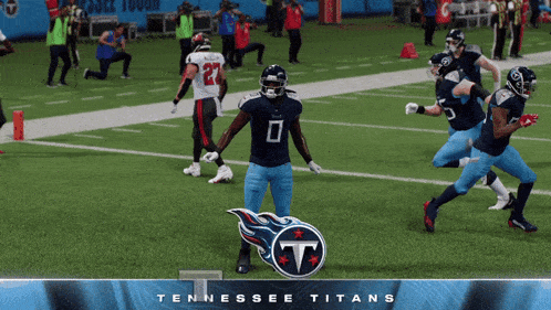 tennessee titans players on a field with a logo
