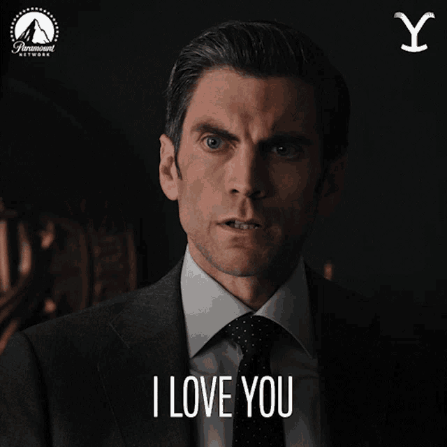 a man in a suit says i love you