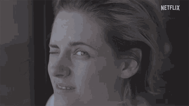a close up of a woman 's face with the word netflix in the corner