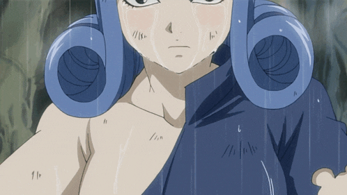 a girl with blue hair and a blue shirt is crying