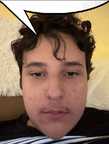 a close up of a man 's face with a speech bubble above it