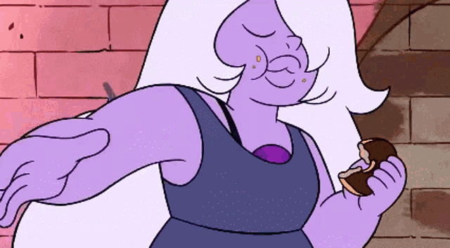 a purple cartoon character is holding a piece of chocolate