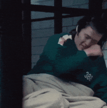 a man wearing a green sweatshirt with the number 388 on it
