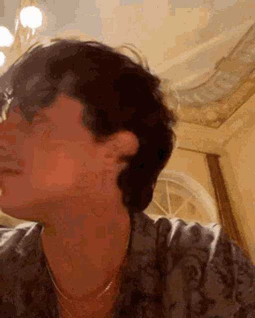a close up of a man 's face with his eyes closed