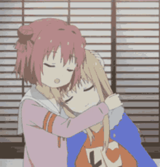 a couple of anime girls hugging each other in front of a window .