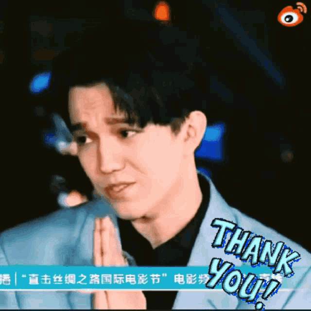 a man with his hands folded and the words thank you on the bottom
