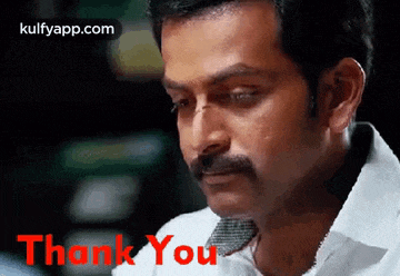 a man with a mustache is giving a thank you gesture .