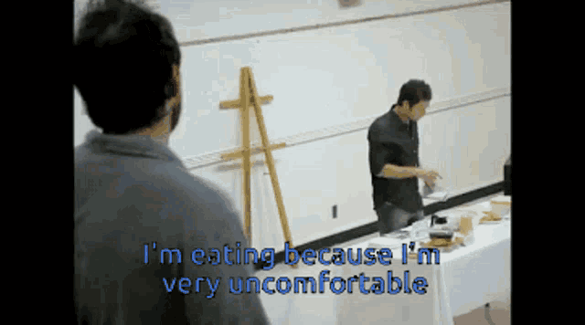 a man is eating because he is uncomfortable