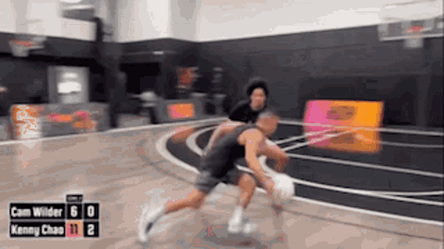 a basketball game between cam wilder and kenny chase is going on