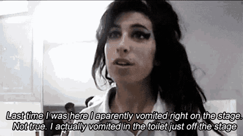 a woman is talking about vomiting in the toilet while on stage .
