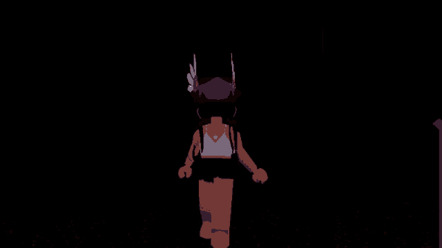 a girl in a white top and black shorts is walking in a dark room