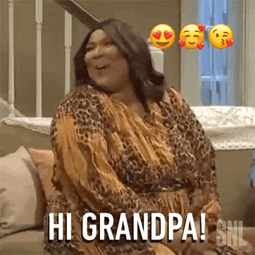 a woman in a leopard print dress is sitting on a couch and says hi grandpa