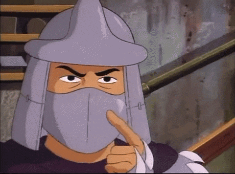 a cartoon character is wearing a mask and giving a thumbs up sign