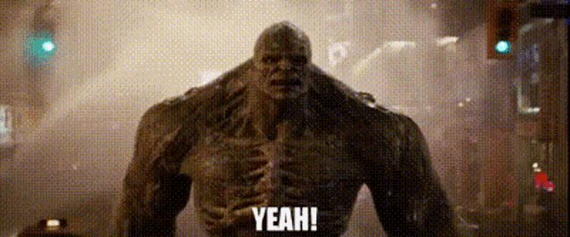 a monster is standing in the middle of a street holding a microphone and saying yeah .