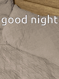 a blurred image of a person laying on a bed with the words good night above them