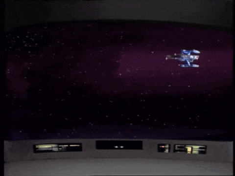 a computer screen shows a space ship flying through the space .