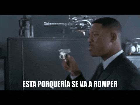 a man in a suit is holding a gun and says " esta porqueria se va a romper " in spanish