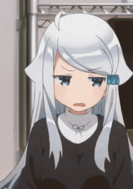 a girl with white hair and blue eyes is wearing a black top