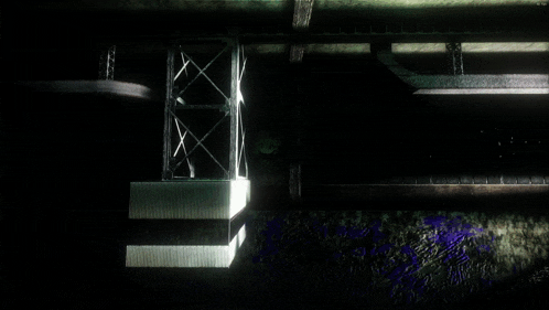 a dark room with a purple stain on the wall and a metal structure
