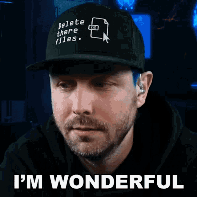 a man wearing a hat that says delete there files says i 'm wonderful