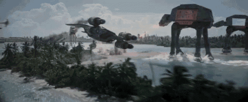 a group of at at walkers are flying over a small island in the middle of a body of water .
