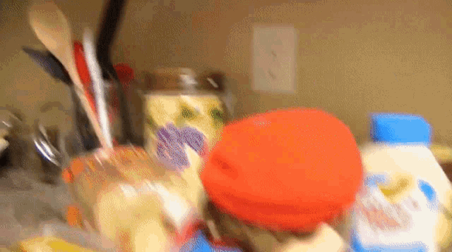 a bottle of mayonnaise sits on a counter next to other items