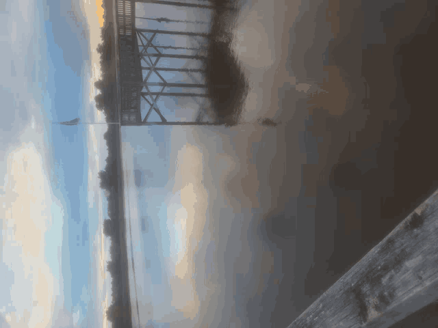 a view of a bridge over a body of water
