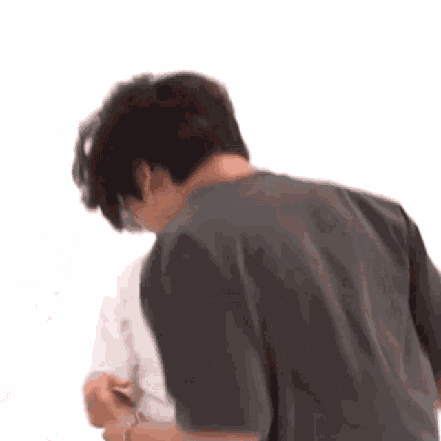 a man in a black shirt is standing next to a woman in a white shirt .
