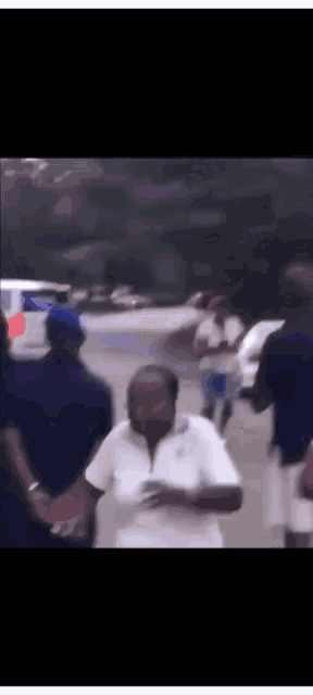 a blurry picture of a group of people walking