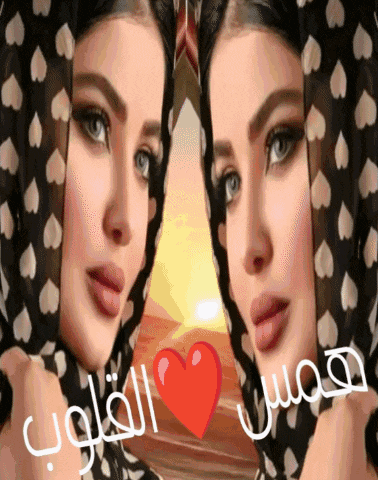 a woman wearing a scarf with hearts on it has a red heart in front of her face