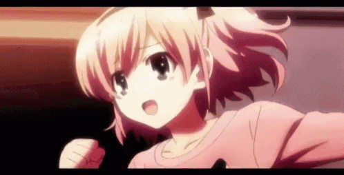 a girl with pink hair is wearing a pink sweater