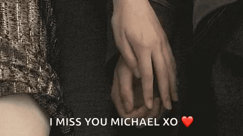 a man and woman are holding hands with the words `` i miss you michael xo '' written on the bottom .