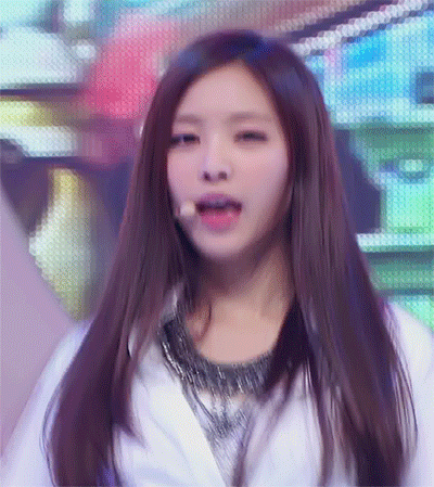 a woman with long hair is wearing a white shirt