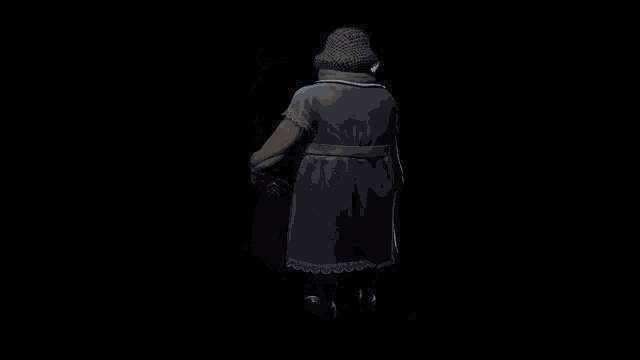 a statue of an old woman wearing a blue apron