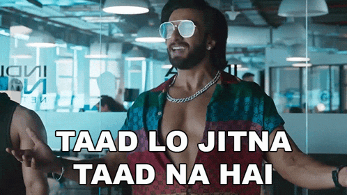a man wearing sunglasses and a shirt that says ' taad lo jitna taad na hai '