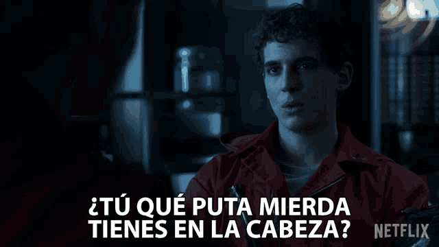 a man in a red jumpsuit says " tu que puta mierda tienes en la cabeza " in spanish