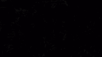 a bunch of skeletons are dancing in a dark room .