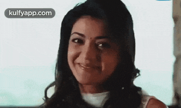 a close up of a woman 's face with a smile on it .