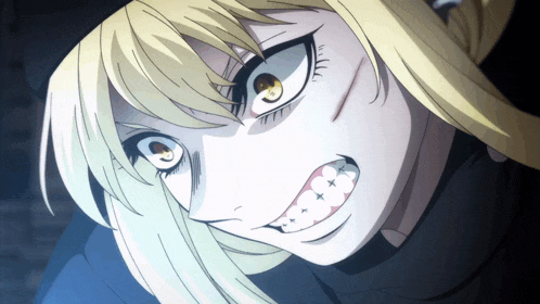 a close up of a girl 's face with a very angry look on her face