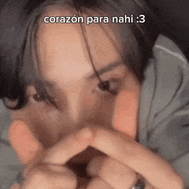 a close up of a person 's face with the words corazon para nahi written on the top