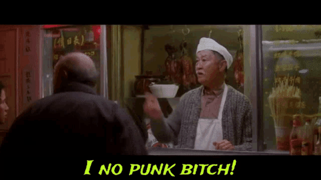 a man in an apron is pointing at another man in front of a sign that says i no punk bitch ..