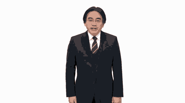 a man in a suit and tie is making a gesture
